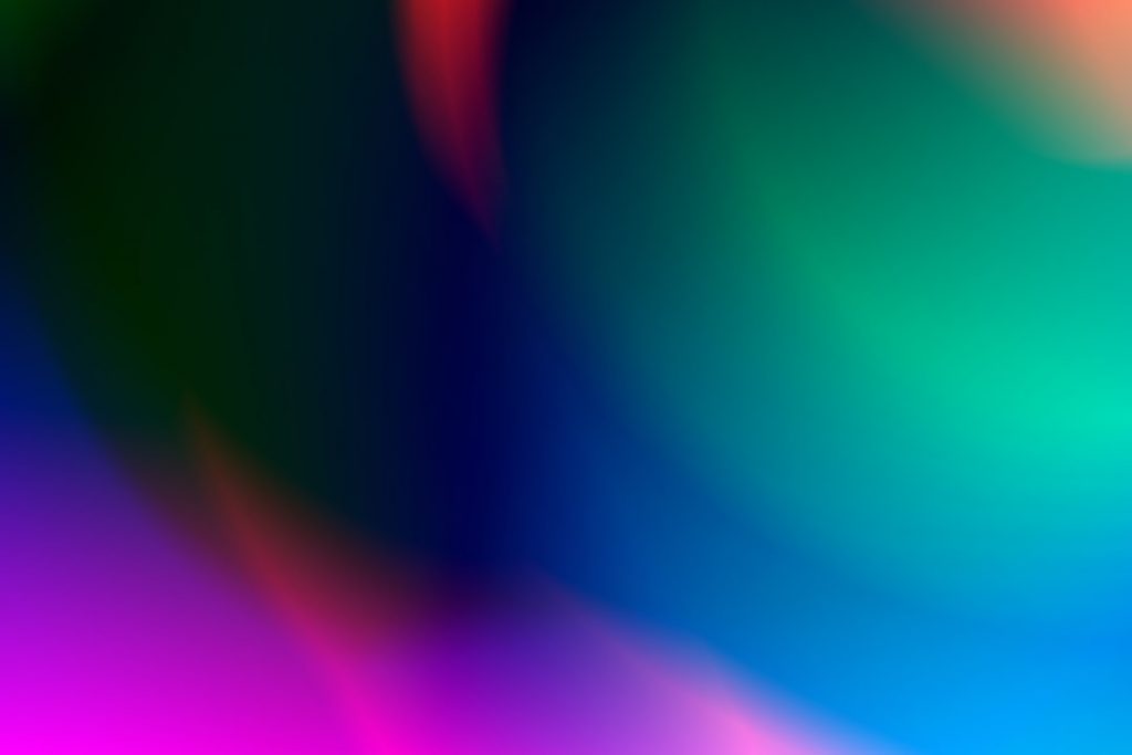 Abstract image featuring smooth gradients and soft, swirling shapes in vibrant blue, green, pink, purple, and red tones, blending seamlessly to create a colorful, dreamy, and fluid appearance.